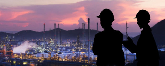 Silhouette engineers are standing orders The oil refining indust