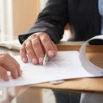 Business people signing a contract
