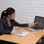 Young business woman working with document at office.